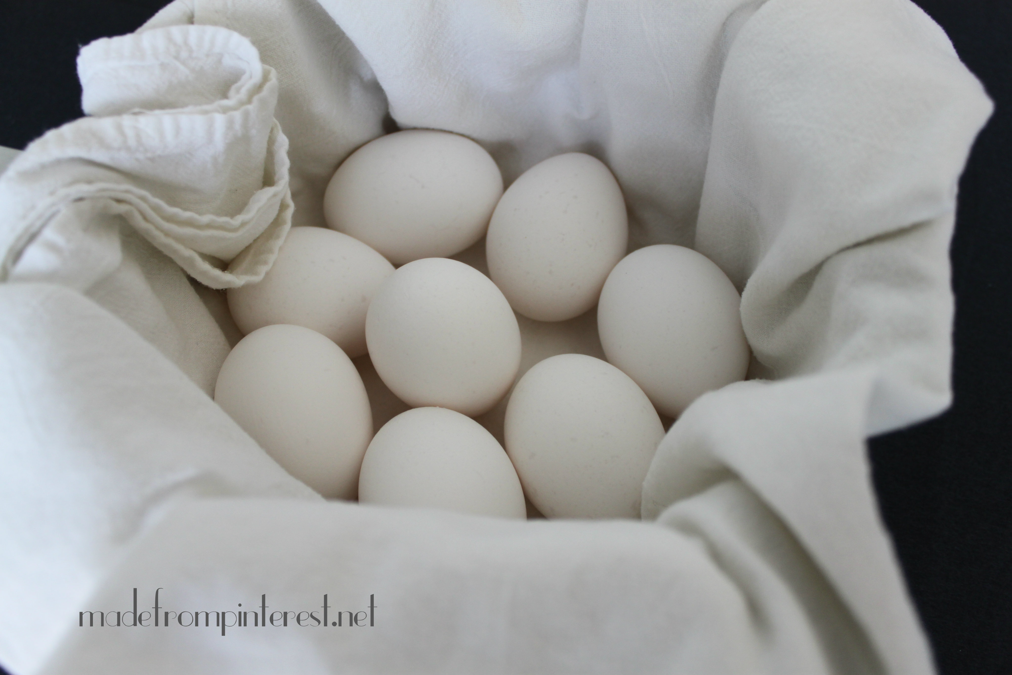 Place a clean white cotton kitchen towel in pot to cushion eggs so they won't crack @madefrompinterest.net
