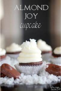 Almond Joy Cupcake - These lovely Almond Joy Cupcakes taste as good as they look! The chocolate ganache in the center of the cupcake is to DIE for!