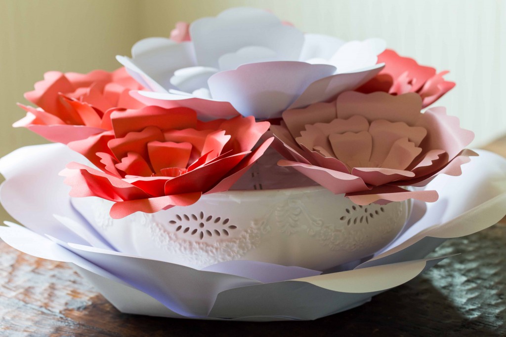 Easy paper flowers make a beautiful centerpiece. These would be great for garden parties, little girls rooms, and photo backdrops.